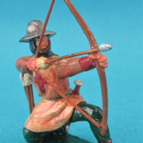 29.   Archer croisé ou normand à genoux tirant.